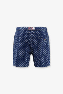 Navy blue mc2 saint barth men’s nylon swim shorts with white circular dot pattern and branded waistband label