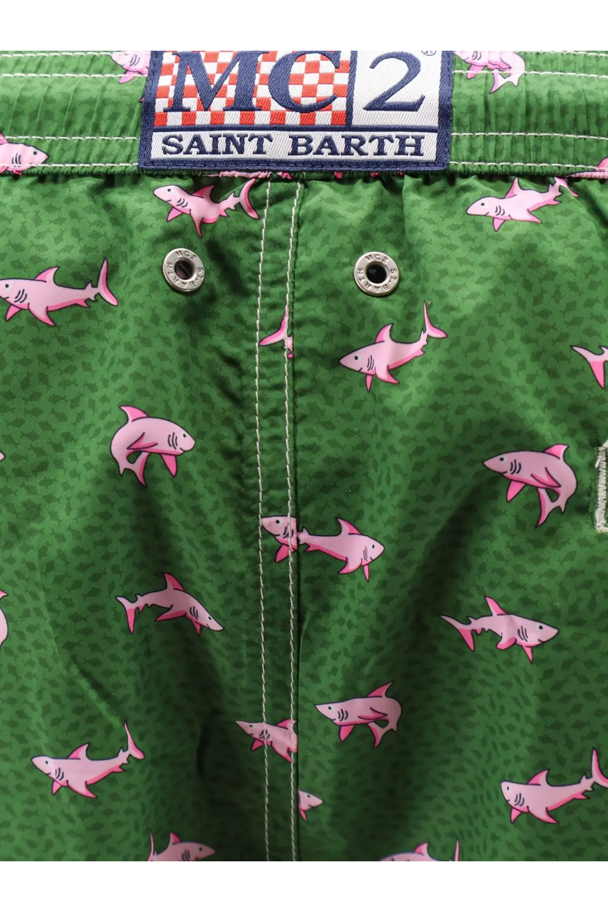 Green swim trunks with pink shark pattern and mc2 saint barth label made from recycled material for men