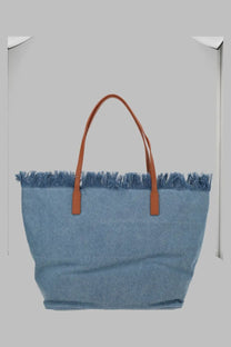 Light blue denim tote bag with brown leather handles and frayed top edge from mc2 saint barth