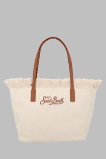 Cream-colored canvas tote bag with brown leather handles and embroidered mc2 saint barth logo in matching brown thread