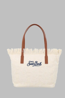 Cream-colored canvas tote bag with brown leather handles and frayed edge featuring embroidered mc2 saint barth logo in navy blue
