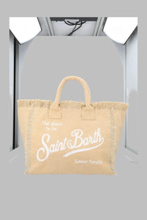 Beige canvas tote bag with white frayed edges and handles featuring saint barth cursive and summer paradise print