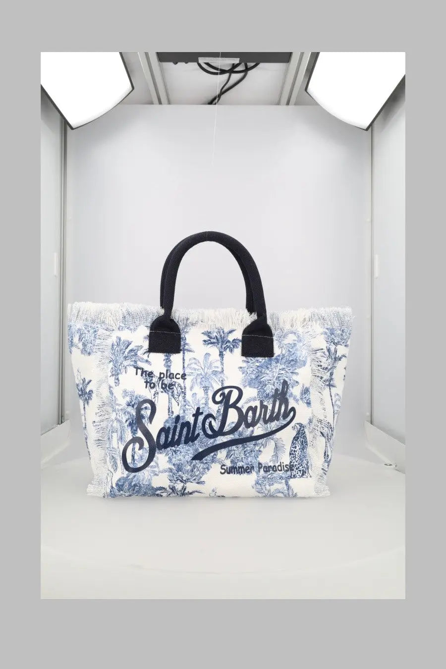 White canvas tote bag with blue palm tree print black handles and saint barth cursive logo by Mc2 Saint Barth
