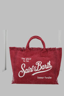 A vibrant red canvas tote bag with white frayed trim and saint barth summer paradise logo in stylish script font