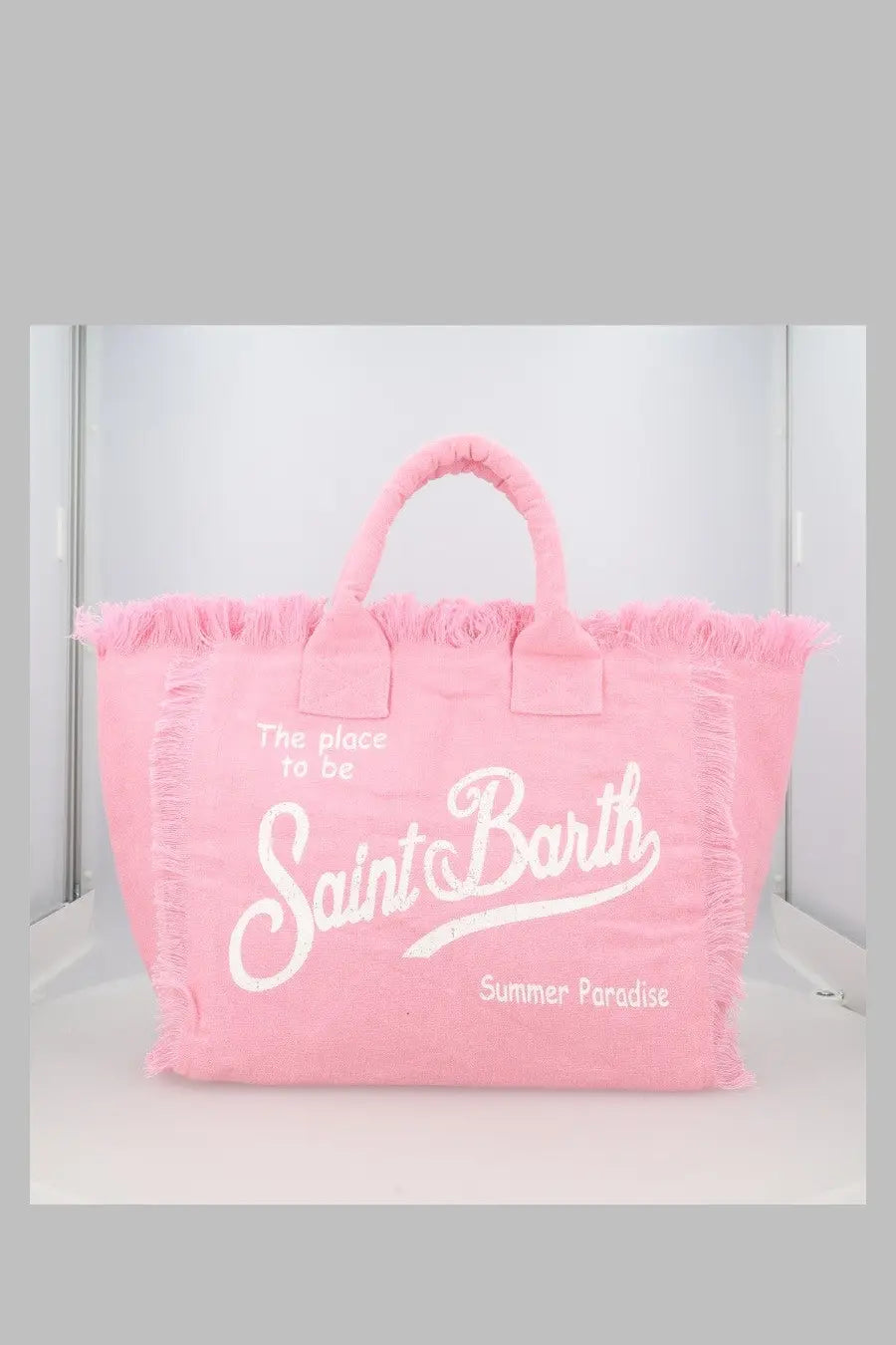 Pink canvas tote bag with frayed edges and white embroidered text from mc2 saint barth in lino blue