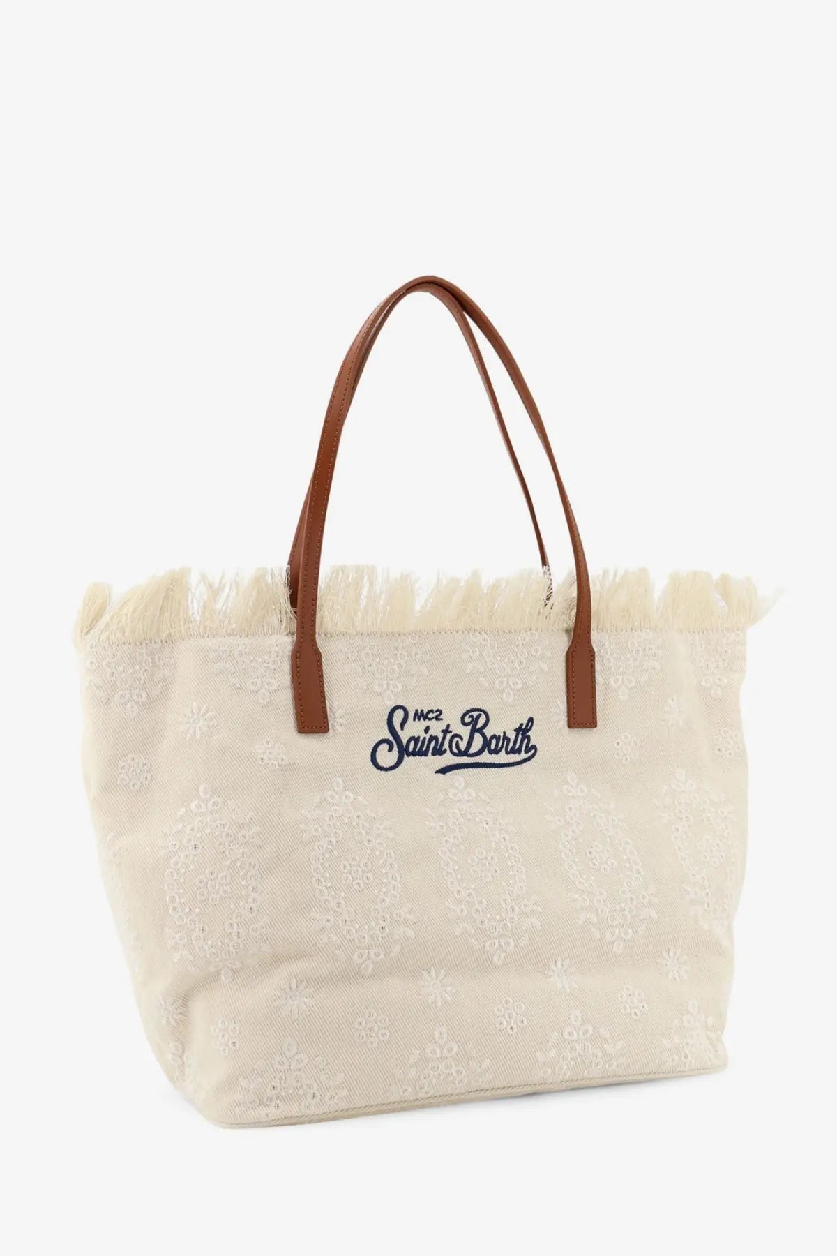 Beige canvas tote bag with brown leather handles and frayed top edge embroidered m.c by Mc2 Saint Barth