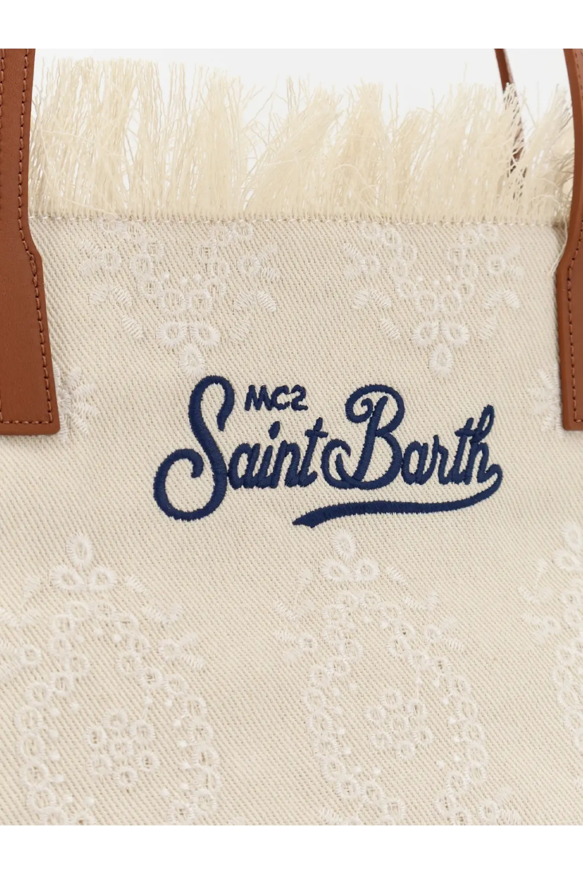 Cream-colored canvas Mc2 Saint Barth women’s le city shoulder bag with white lace, brown leather handles, and navy logo