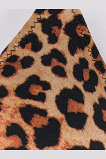 Close-up of mc2 saint barth women’s leah nylon bikini top in beige leopard print with bold black spots and stitched edge