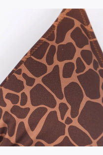 A close-up of Mc2 Saint Barth women’s leah nylon bikini top in brown and tan giraffeskin with zigzag stitching