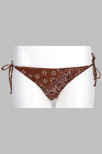 Brown bandana-patterned triangle bikini bottom with white paisley and floral motifs and adjustable side ties by mc2 saint barth