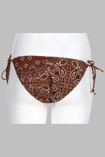 Brown bandana-patterned triangle bikini bottom with white and dark brown paisley design and adjustable side ties by mc2 saint barth