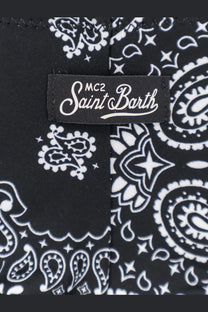 Black fabric with white paisley and star pattern and mc2 saint barth label on women’s stretch nylon bikini bottoms