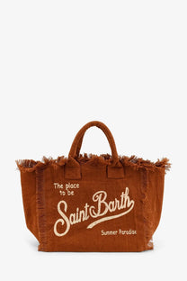 Brown canvas linen tote bag with frayed edges and white embroidered saint barth summer paradise text
