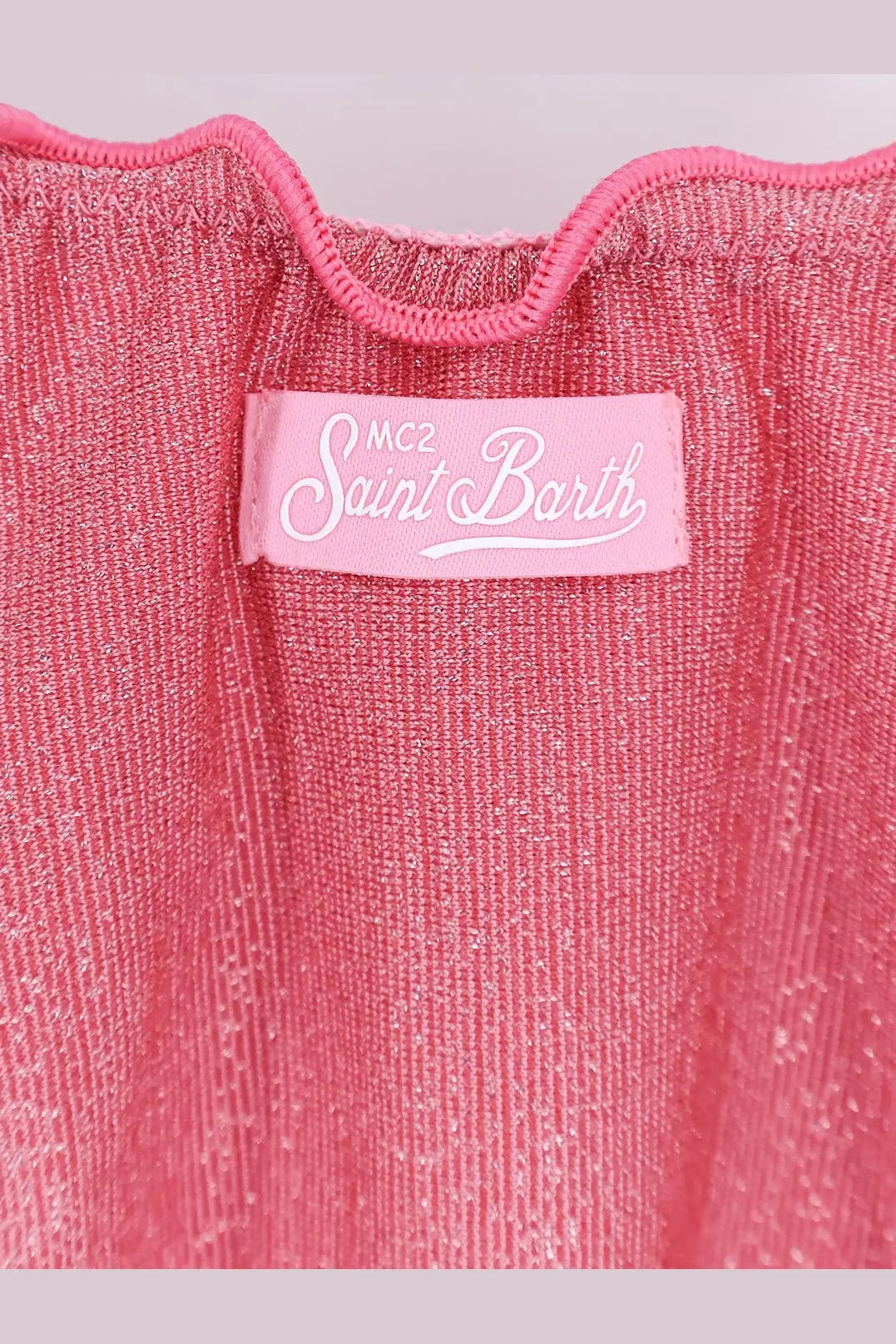 A shimmering pink knit top with scalloped neckline and mc2 saint barth label paired with viscose blend moon bikini bottoms lurex