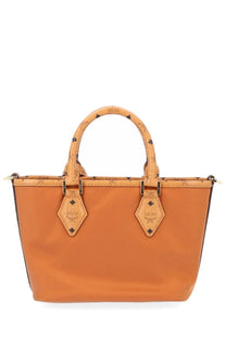 Orange mcm women’s aren mini shopper tote bag with tan handles and diamond-shaped leather accents in beige