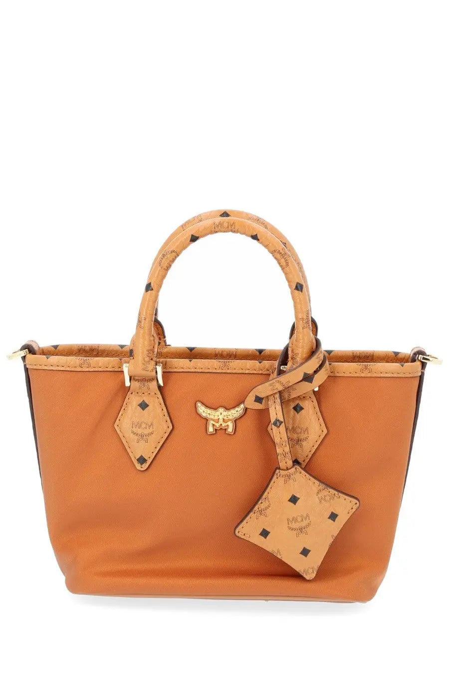Tan mcm women’s aren mini shopper tote bag in beige with signature monogram pattern and gold tone hardware