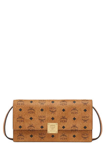 Tan leather mcm women’s aren wallet beige clutch bag with repeating logo pattern and gold-tone hardware