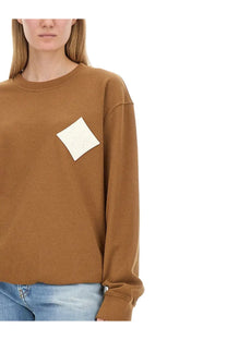 Mcm women’s beige cotton sweatshirt with a cream diamond patch on the chest for casual wear