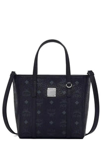 Black MCM women’s Toni top zip mini tote bag with embossed logo pattern and silver-tone metal plaque