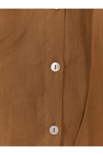 A close-up of mes demoiselles women’s celeste beige cotton shirt with three white buttons on the front placket