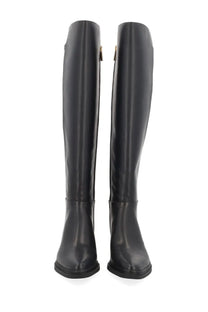 Michael Kors women’s Lex black knee-high leather boots with sleek glossy finish and subtle gold inner zippers
