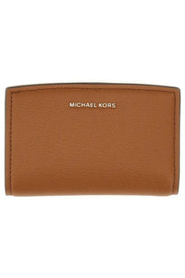 Brown leather michael kors womens bryant medium wallet with gold-tone logo embossed on the front in beige