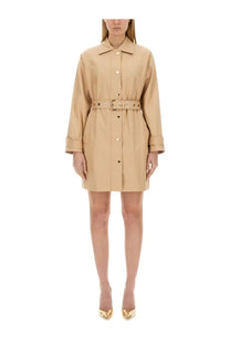 Beige cotton trench coat dress by Michael Kors with button front, belted waist, and rolled cuffs
