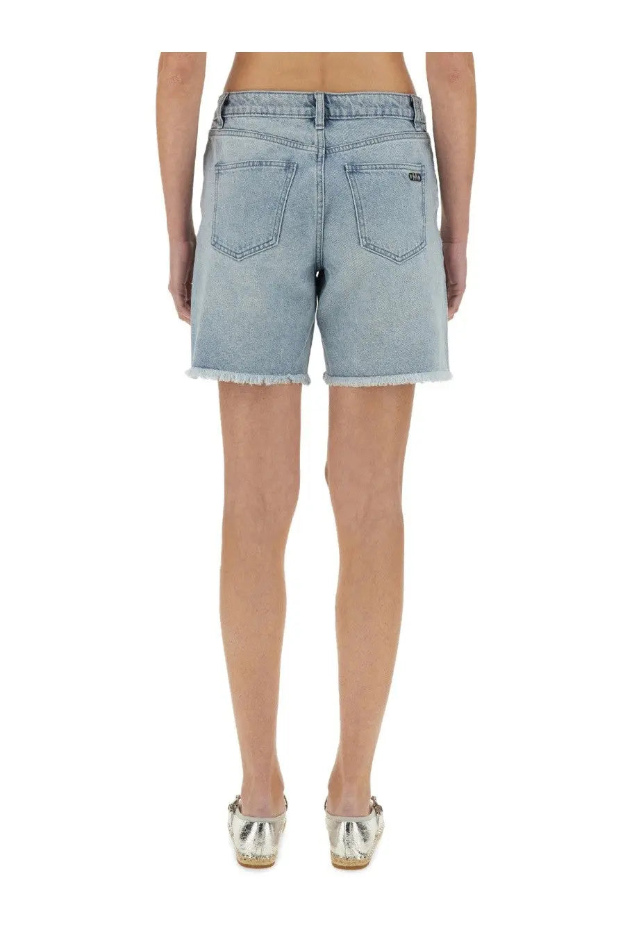 Back view of michael kors women’s light-wash denim boyfriend shorts with frayed hem and back pockets in blue