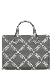 Michael Kors women’s Gigi small tote bag in gray canvas with white chain-link pattern and matching handles