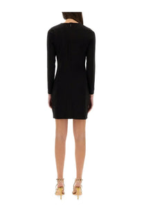 Black long-sleeved fitted jersey mini dress with back zipper by michael kors shown from the back side