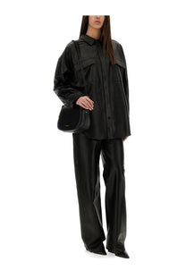 Black leather crossbody bag with sleek minimalist design and subtle stitching complementing michael kors jacket