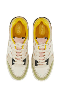 Cream-colored michael kors women’s leather sneakers with yellow black accents pink laces and perforated layered design