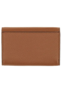 Michael Kors women’s leather wallet in beige tan pebbled leather with neat stitching along the edges