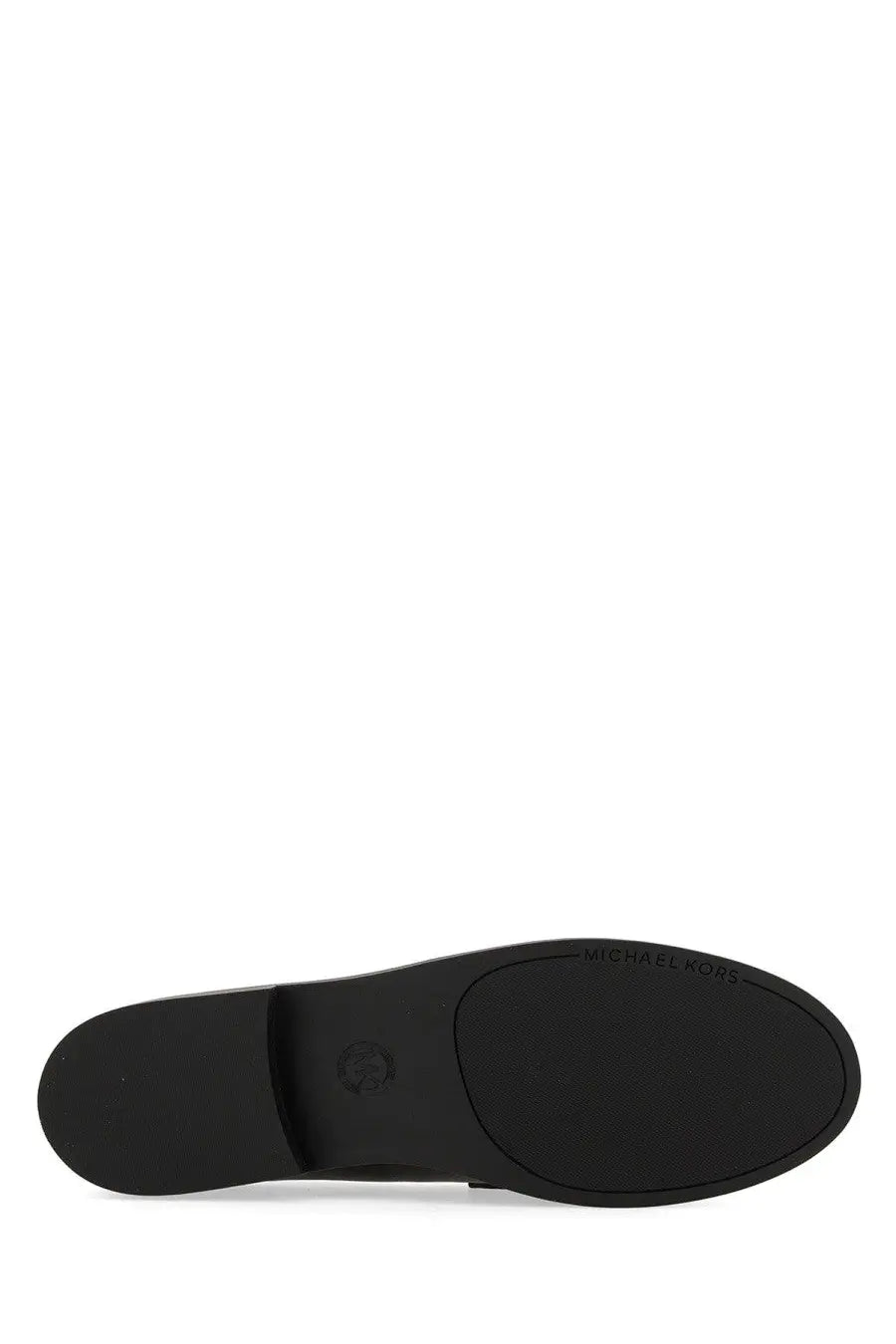Black rubber sole of michael kors womens loafer featuring branding and a circular logo