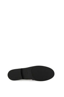 Black rubber sole with textured pattern and embossed branding of michael kors women’s loafer black visible from the back side