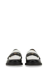 Michael Kors women’s black leather loafers with white accents and gold-tone logo detailing