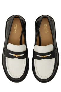 Black and white leather Michael Kors women’s loafer with gold-tone MK logo accent on the front