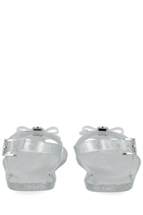 Michael Kors women’s monogram sandal clear glittery jelly with silver metallic straps and bow details