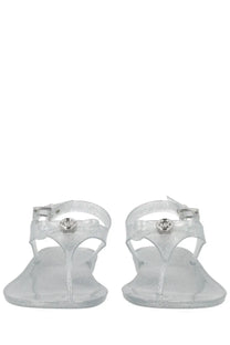 Michael Kors women’s monogram sandal in silver clear glittery jelly with metallic logo charm and buckle detail