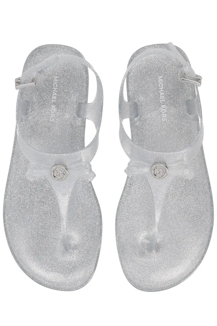 Silver glittery michael kors women’s monogram thong sandals with clear strap and metallic logo buckle