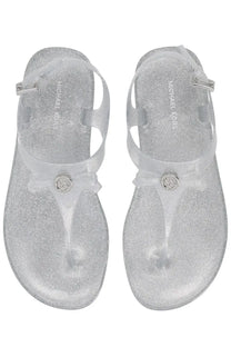 Silver glittery michael kors women’s monogram thong sandals with clear strap and metallic logo buckle