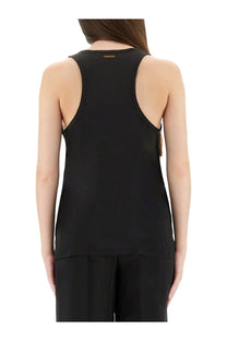 Michael Kors women’s black racerback tank top with sleek minimalist design and gold branding at the neckline