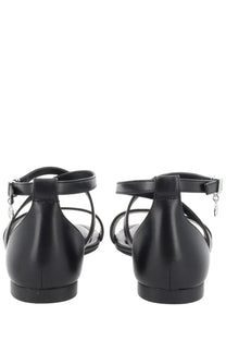 Michael Kors women’s Alexa black patent leather t-strap sandals with low block heel and silver buckle accents