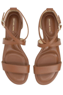 Michael kors women’s sandal alexa brown featuring brown leather with crossed straps and gold-tone buckle details