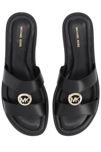 Michael Kors women’s Sandalo Erin black leather slide sandals with gold-toned MK logo emblem on the strap