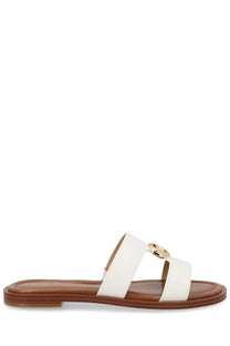 Michael Kors women’s white leather slide sandal with gold-tone circular buckle and brown rubber sole