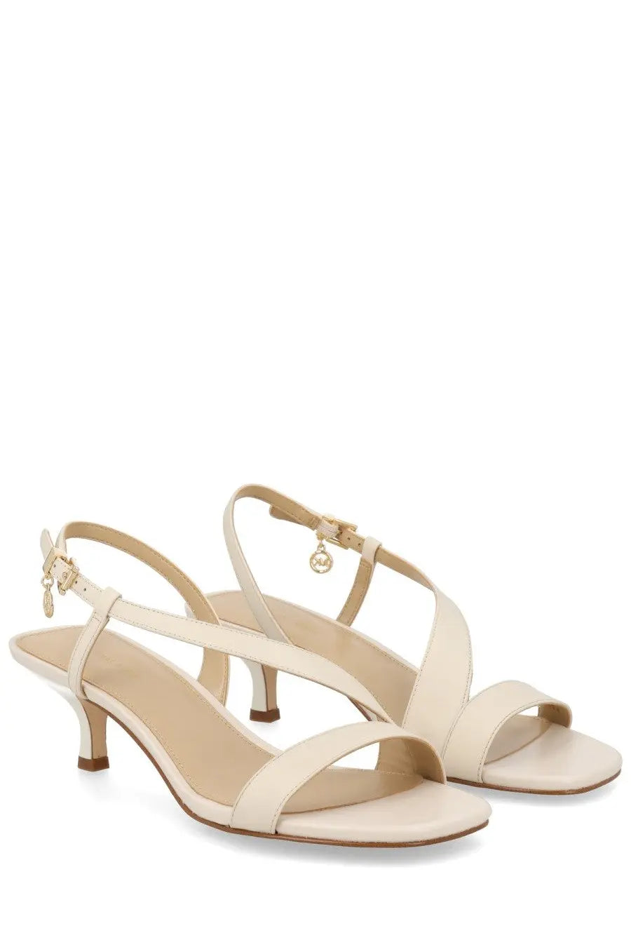 Michael Kors women’s cream leather sandals with low heel and ankle strap featuring gold-tone logo charm