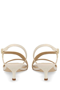 Cream-colored michael kors women’s sandalo jaida con tacco white strappy sandals with sleek minimalist design and ankle straps