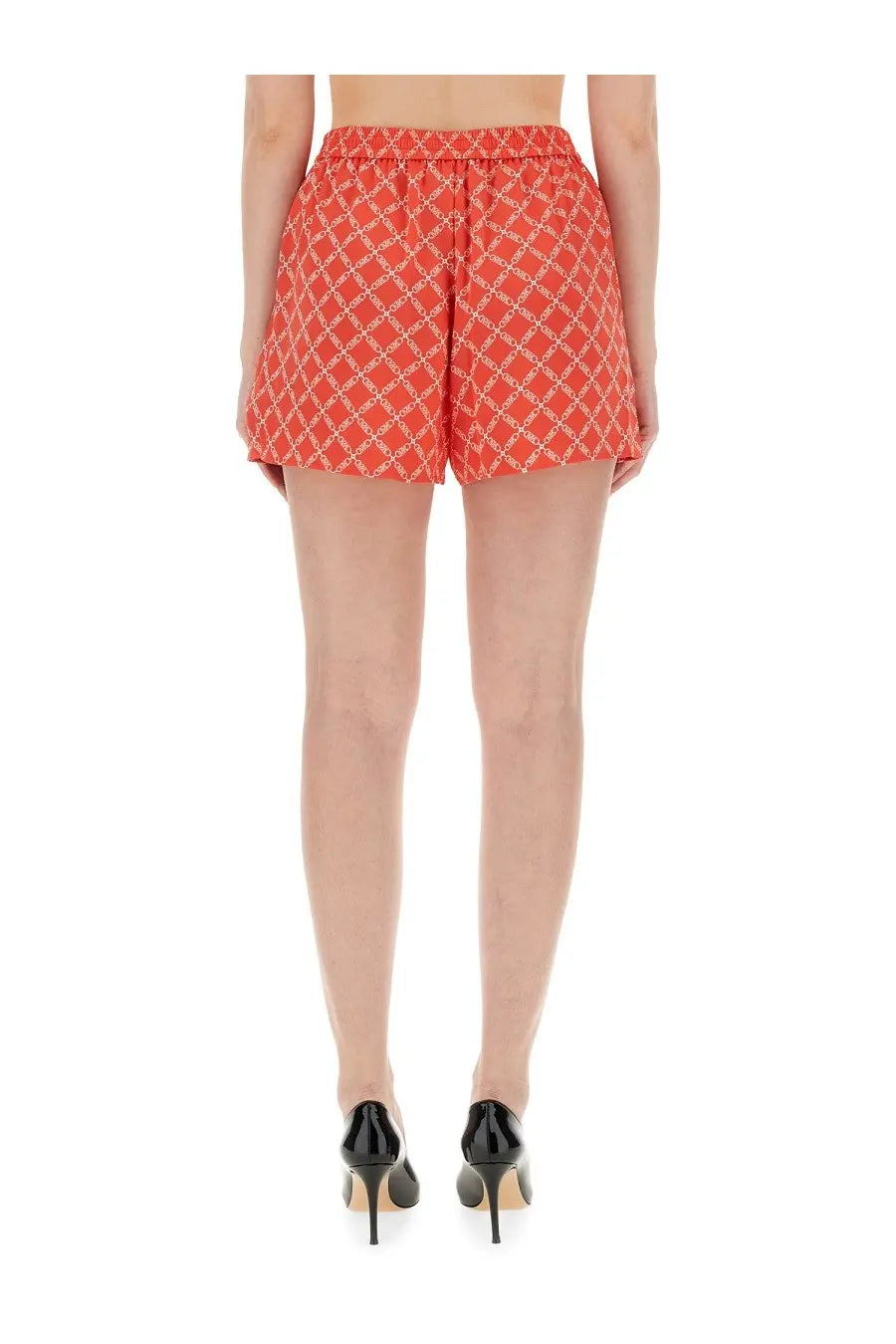 Michael Kors women’s coral shorts with white geometric chain-link pattern and elastic waistband for casual wear