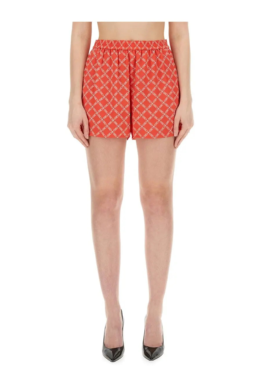 Michael Kors women’s coral shorts with white geometric lattice pattern elastic waistband and flared hem